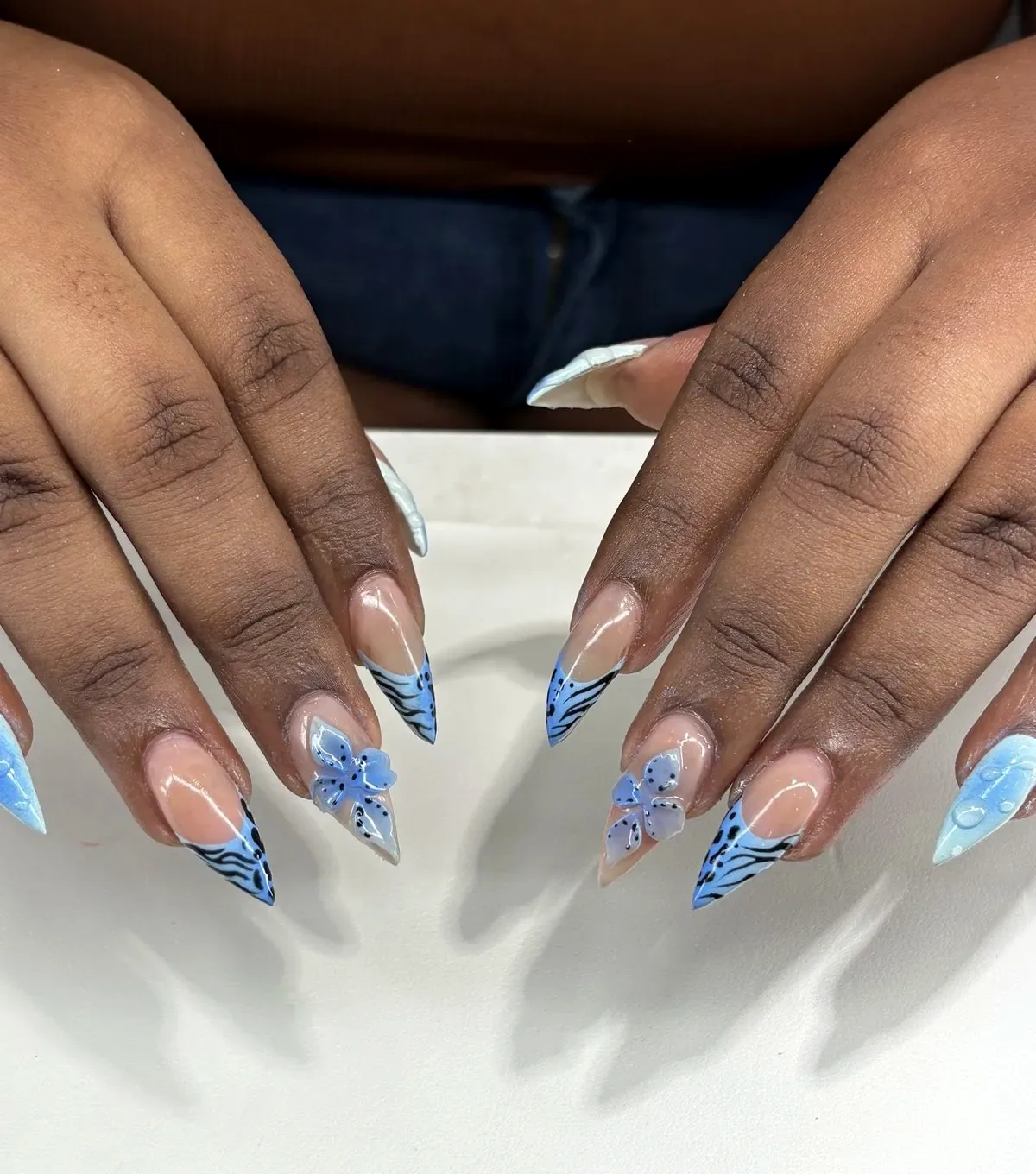 Blue tiger French stilettos done at Numii