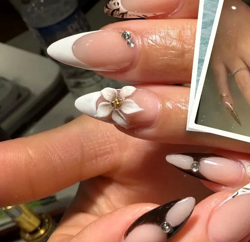 Almond French nails with a white 3D flower